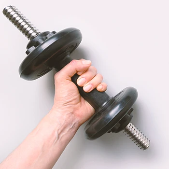 A person holding a dumbbell