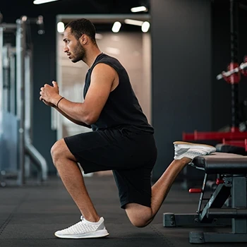 A man doing Bulgarian split squat