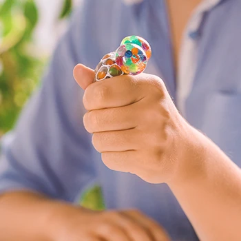 A person squeezing a stress ball