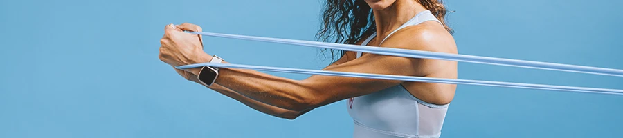 A person working out with a resistance band for triceps