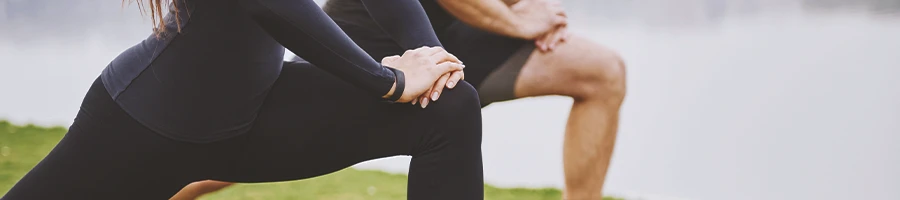 A couple doing knee workouts