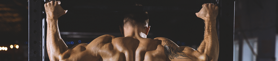 A person with strong grip strength doing pull-ups