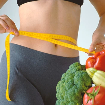 A woman measuring her weight loss