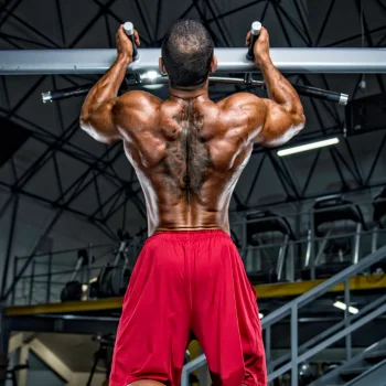 Man doing weighted chin-ups