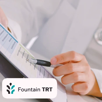 A doctor pointing to a clipboard during Fountain TRT testing