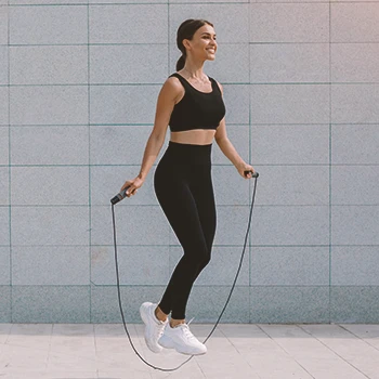 A woman doing high intensity jump rope workouts