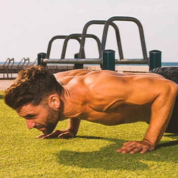 A person doing HIIT for his upper body outside