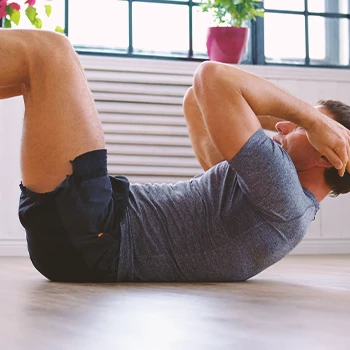 A person doing ab workouts at home