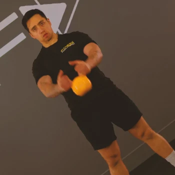 A person doing front raise workouts with kettlebells