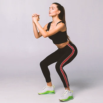 A person doing ISO squats