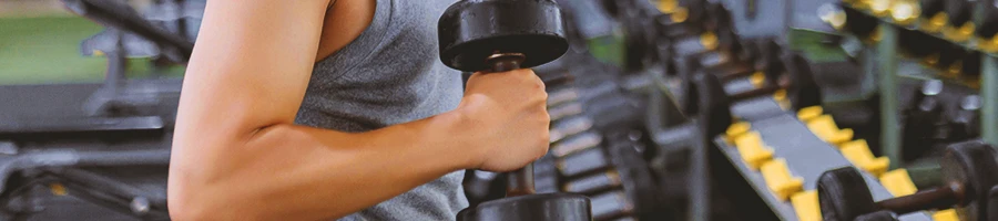 A person doing hammer curls with a dumbbell