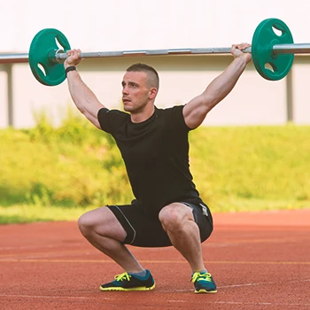 A person doing overhead squats