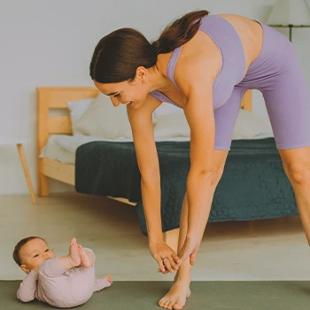 A mother doing yoga at home