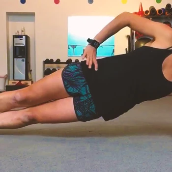 A person doing side plank with hip abduction