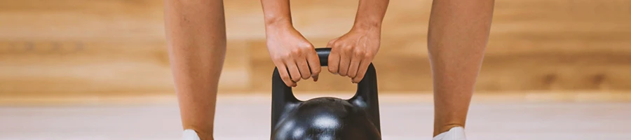A person working out with a kettlebell