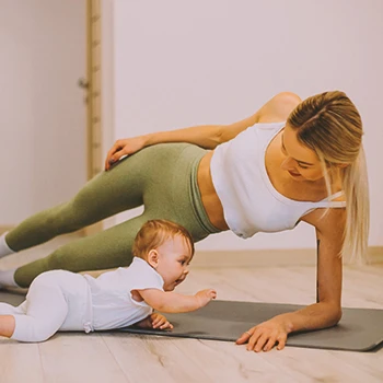 A mother working out at home