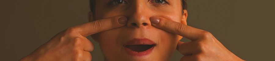 A person stretching her face