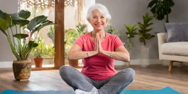An old woman doing exercises at home