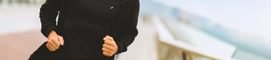 A person jogging outside at the park