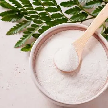 White supplement powder on a spoon