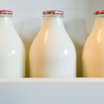 White liquid in a glass bottle