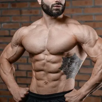 Muscular man showing off his core