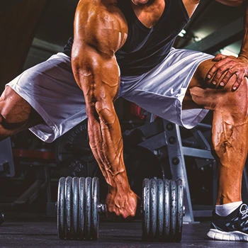 A person lifting a dumbbell for strength workout