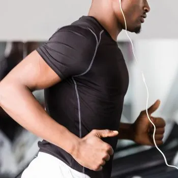 Muscular man exercising in a gym