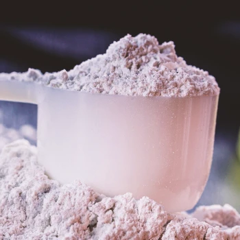 Close up shot of a scoop of whey protein