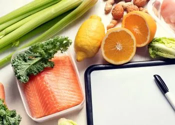 Fruits, vegetables and a notebook