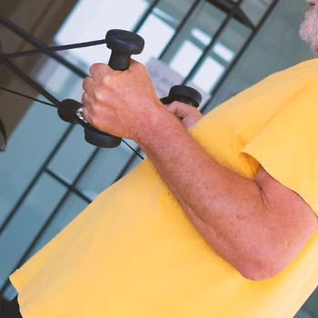 A person doing light workouts at the gym