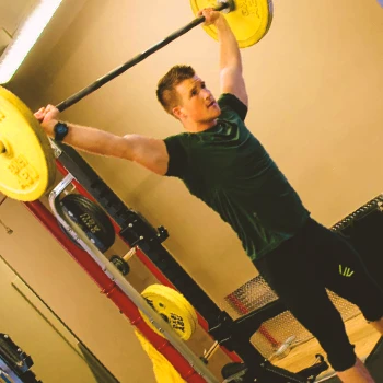 A person doing the snatch press