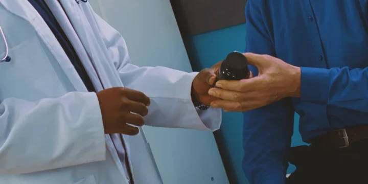 A doctor helping a person with TRT side effects