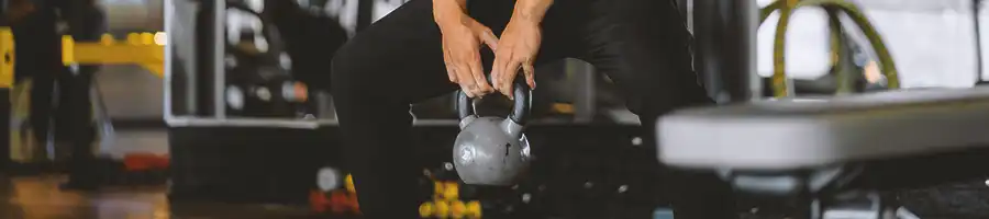 A person doing kettlebell workouts