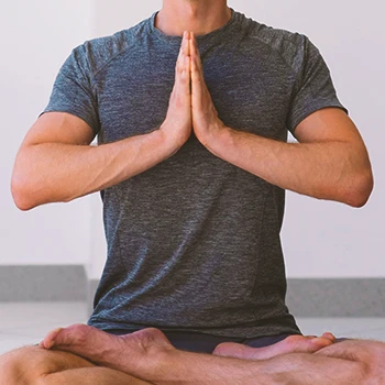 A person at home doing yoga