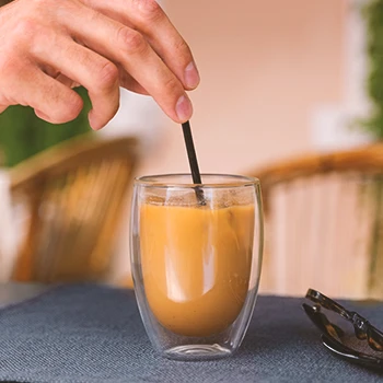 A person making bulletproof coffee