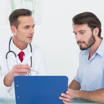A doctor and his client having a medical analysis of test results for TRT