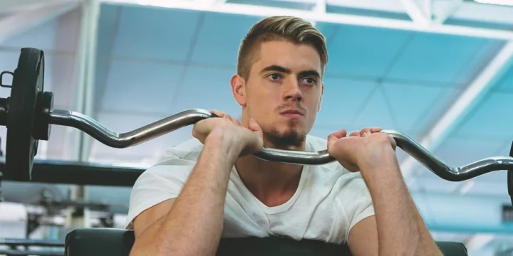 Man doing exercise with one of the muscle groups to maximize gains