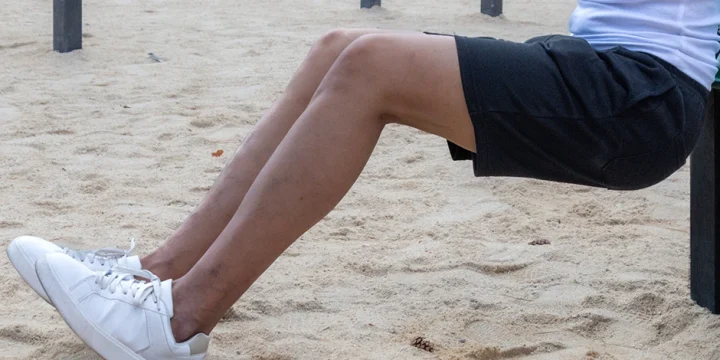 A person working out tibialis anterior with outside exercise