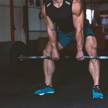 A man doing intense deadlift in the gym