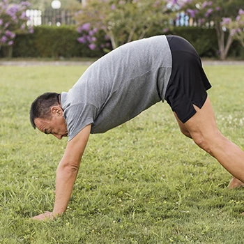 Man doing hindu push ups outside