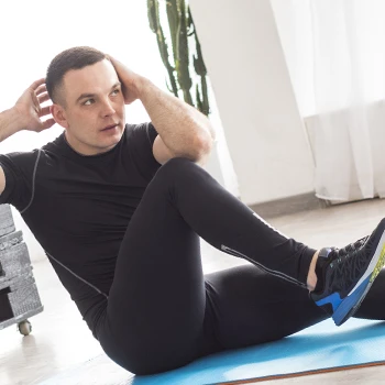 A man doing workout on floor