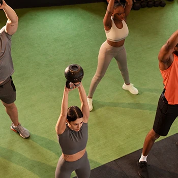 Group of persons working out in the gym