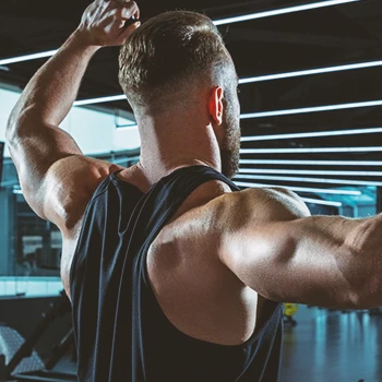 A man doing strength exercise in gym