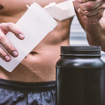 A man going to scoop a mass gainer