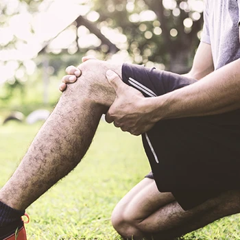 A person holding injured quads