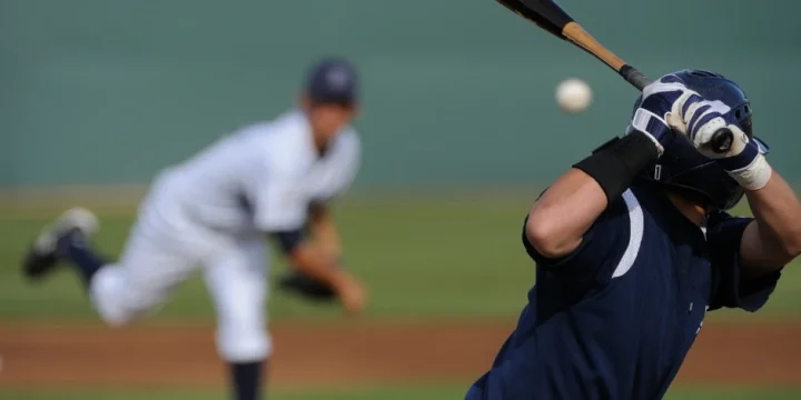 The two men playing baseball on the field.