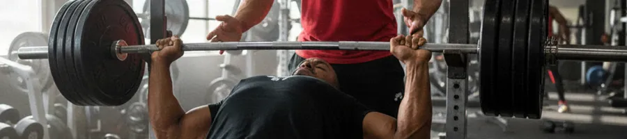 Larry doing a bench press workout in the gym