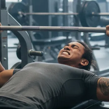 Bretman doing a bench press