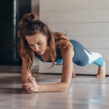 A woman doing planks as her workout routine